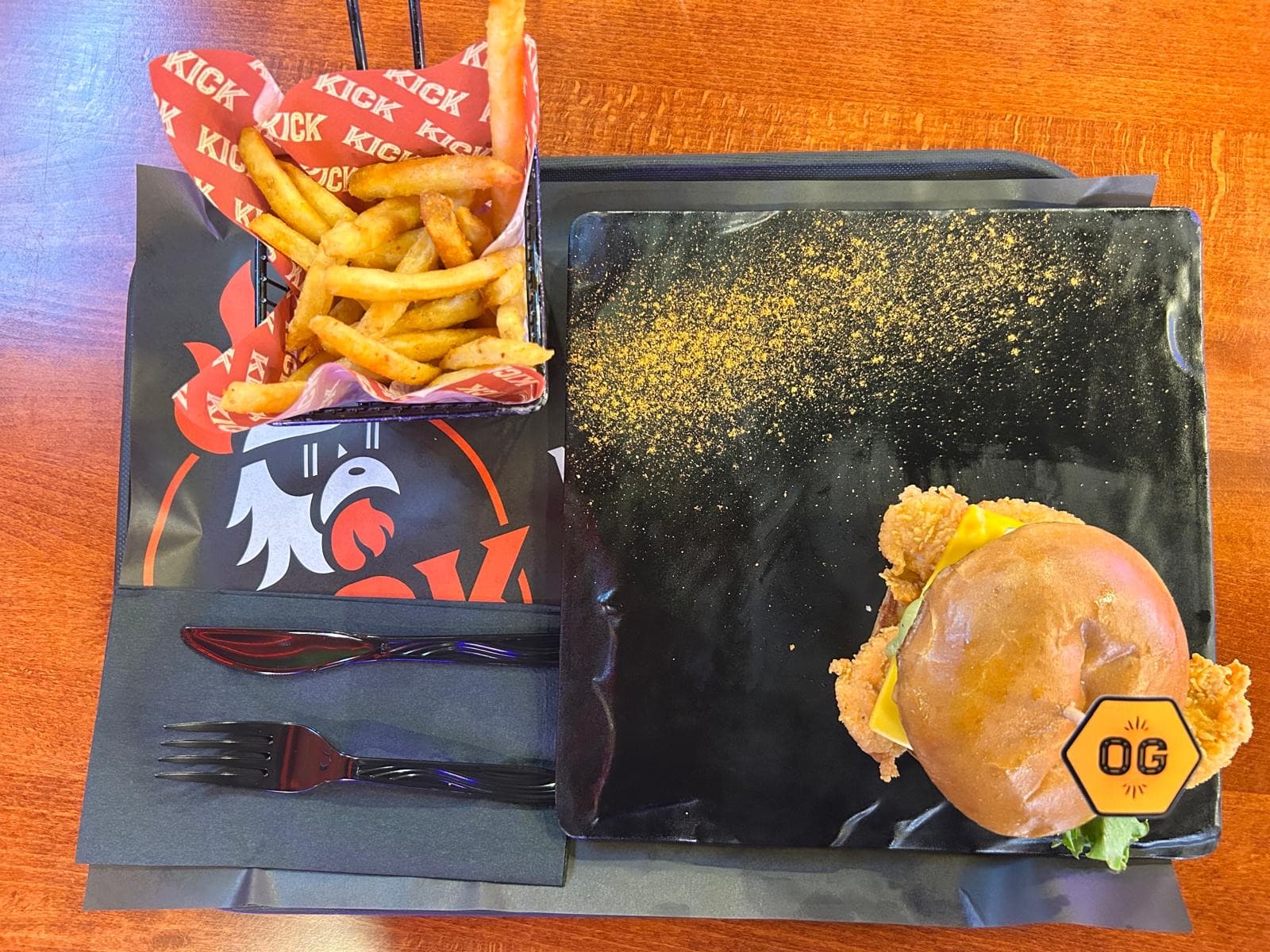 Kwik Classic burger and fries on a branded tray